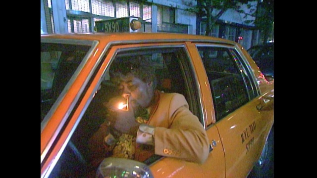 Video Reference: Vehicle, Car, Motor vehicle, Mode of transport, Vehicle door, Automotive window part, Automotive exterior, Photography, Glass, Outdoor, Building, Man, Sitting, Orange, Street, Yellow, Front, Small, Television, Young, Holding, Dog, Boy, Standing, Riding, City, Bus, Bed, Fire, Land vehicle, Transport