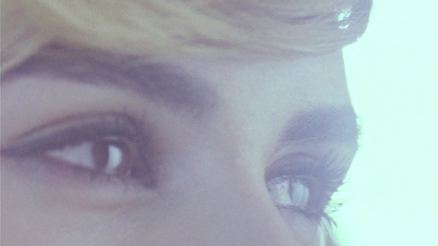 Video Reference: eyebrow, face, eye, eyelash, nose, forehead, cheek, lip, close up, purple