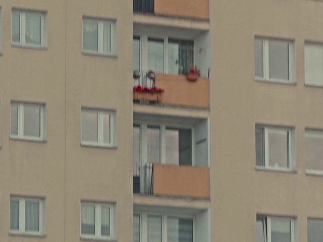 Video Reference: Property, Apartment, Building, Facade, Residential area, Yellow, Window, Neighbourhood, Real estate, Home