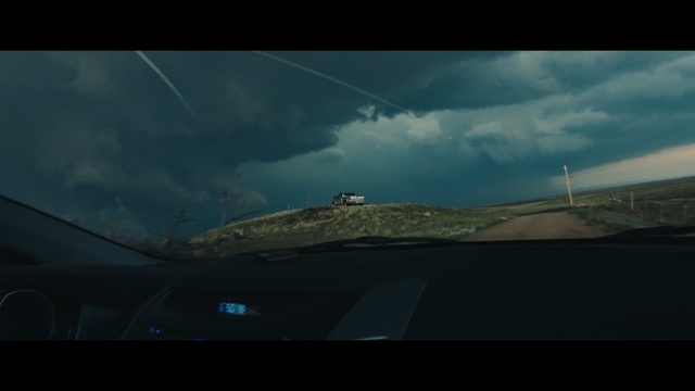 Video Reference: sky, ecosystem, cloud, atmosphere, mode of transport, screenshot, road, horizon, meteorological phenomenon, fixed link