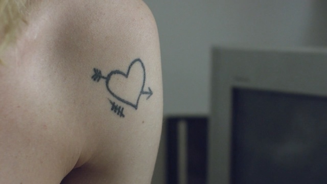 Video Reference: tattoo, shoulder, joint, arm, temporary tattoo, neck, hand, chest, back, font, Person