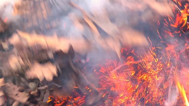 Video Reference: geological phenomenon, sky, fire, computer wallpaper, flame, sunlight, smoke, autumn, Person