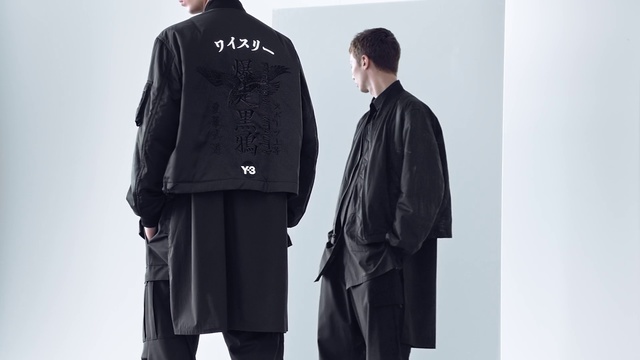 Video Reference: Clothing, Overcoat, Outerwear, Standing, Fashion, Sleeve, Coat, Uniform, Suit, Jacket