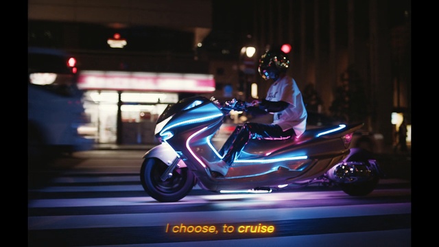 Video Reference: crash helmet, helmet, vehicle, headdress, conveyance, motor scooter, wheeled vehicle, speed, clothing, motor, motorcycle, road, car