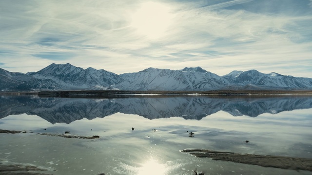 Video Reference: Body of water, Sky, Reflection, Nature, Mountain, Mountainous landforms, Water, Ice, Mountain range, Glacial lake