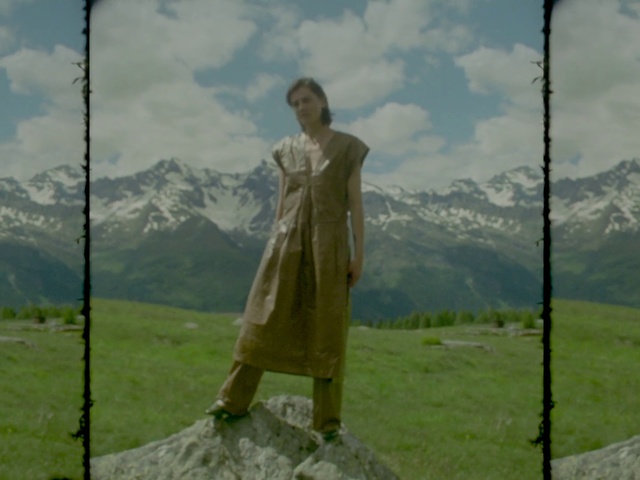 Video Reference: Hill station, Grassland, Outerwear, Landscape, Mountain range, Hill