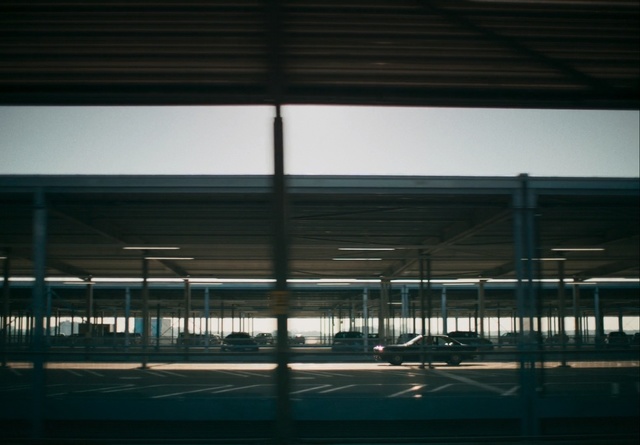 Video Reference: Sky, Architecture, Line, Urban area, Iron, Glass, Building, Reflection, Cloud, Metal, Fence, Window, Sitting, Standing, Track, Train, Man, Dark, Riding, Runway, Large, Woman, Light, Green, Night, White, People, Bridge, Street, Air, Airplane, Bus, Clock, Plane, Airport