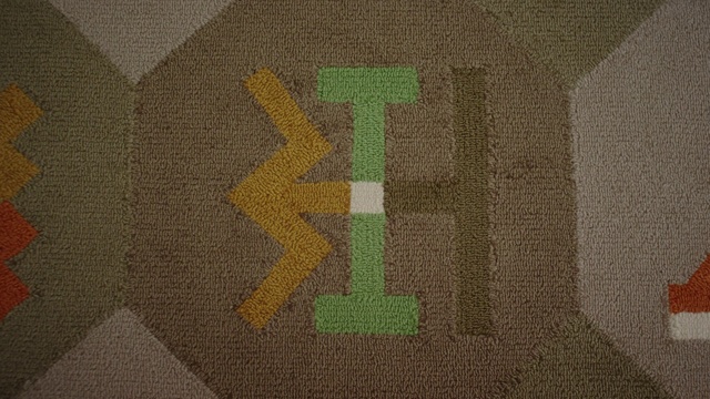 Video Reference: Green, Brown, Textile, Font, Pattern, Video game software, T-shirt