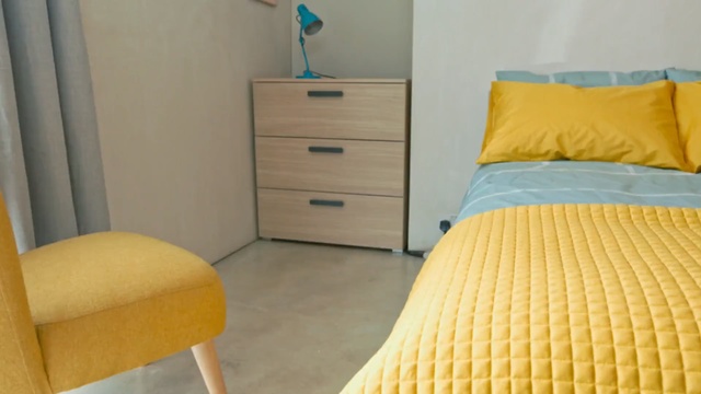 Video Reference: yellow, room, property, bedroom, bed frame, furniture, bed, floor, product, mattress