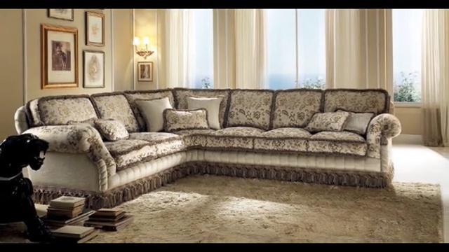 Video Reference: furniture, couch, living room, loveseat, room, home, interior design, sofa bed, angle, recliner, Person