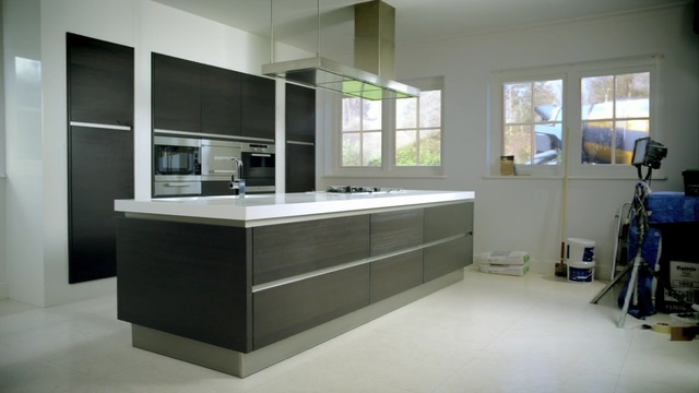 Video Reference: countertop, kitchen, room, cabinetry, interior design, sink, Person