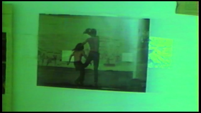 Video Reference: green, text, snapshot, display device, technology, electronic device, square, picture frame, modern art, art