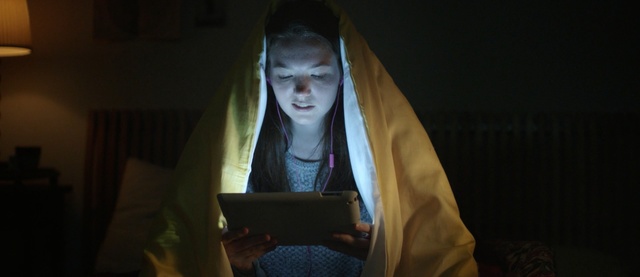 Video Reference: laptop, computer, portable computer, notebook, personal computer, smile, adult, business, work, working, seat belt, happy, office, person, grand piano, portrait