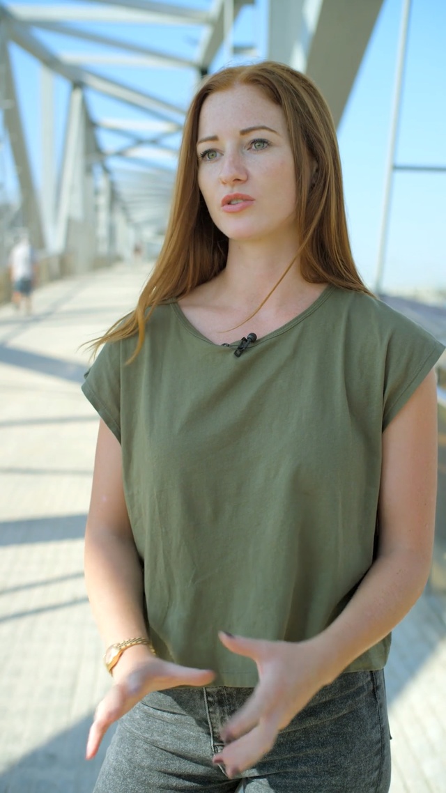 Video Reference: Hair, Clothing, Green, Shoulder, Khaki, Beauty, T-shirt, Neck, Sleeve, Fashion, Person