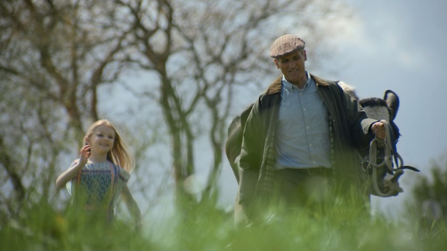 Video Reference: grass, grassland, prairie, sky, plant, meadow, grass family, tree, girl, sunlight, Person