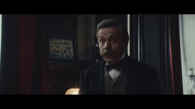 Video Reference: Photograph, Gentleman, Suit, Darkness, Head, Facial hair, Movie, Male, Formal wear, Screenshot
