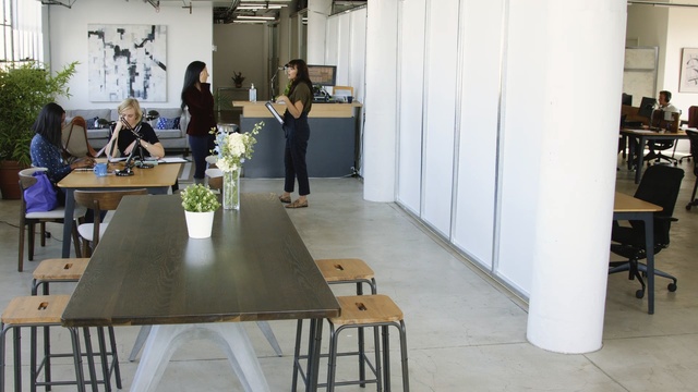 Video Reference: White, Table, Floor, Interior design, Room, Furniture, Architecture, Design, Flooring, Building, Indoor, Chair, Sitting, Kitchen, Dining, Area, Standing, Living, People, Woman, Wine, Wooden, Laptop, Man, Green, Desk, Holding, Group, Eating, Flower, Houseplant, Vase, Flowerpot, Coffee table, Clothing, Dining table