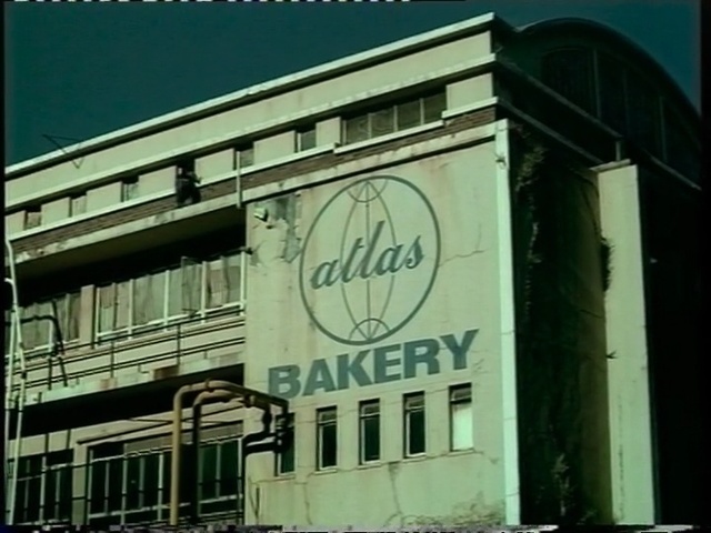 Video Reference: landmark, building, town, architecture, facade, commercial building, advertising, neighbourhood, residential area, house, Person