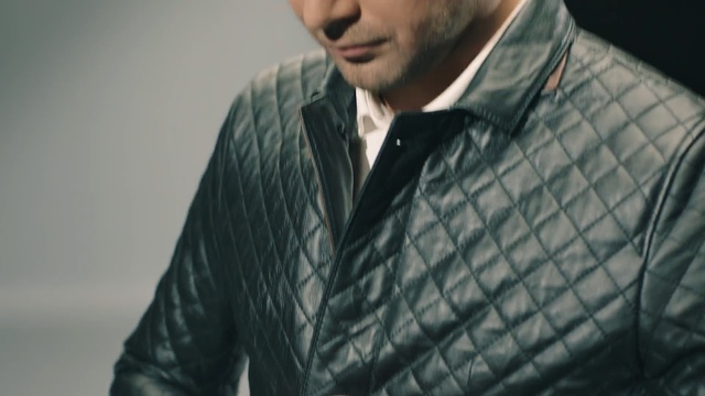 Video Reference: suit, jacket, gentleman, outerwear, formal wear, blazer, leather jacket, textile, facial hair, top