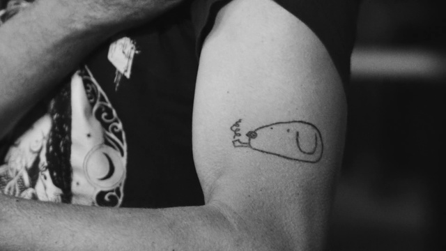 Video Reference: Tattoo, Arm, Joint, Shoulder, Temporary tattoo, Leg, Font, Human leg, Black-and-white, Human body