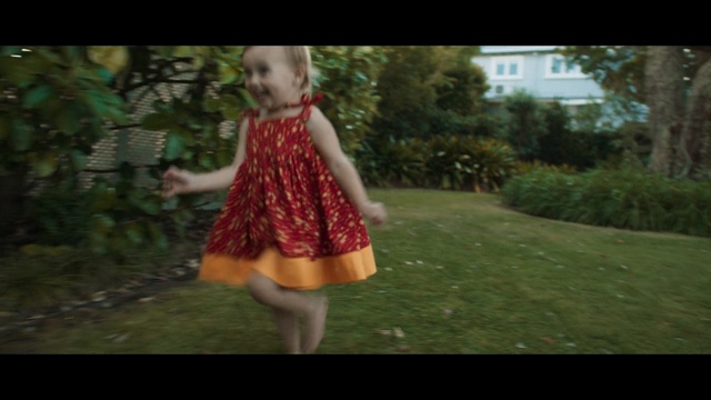 Video Reference: poncho, cloak, garment, trampoline, gymnastic apparatus, clothing, person, people, child, park, sports equipment