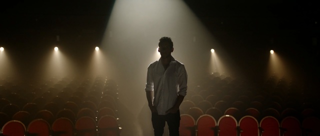 Video Reference: darkness, light, performance, stage, entertainment, night, event, scene, concert, midnight, Person