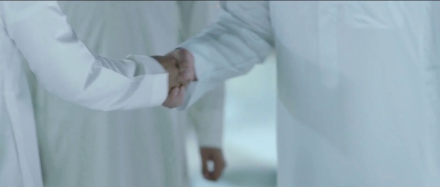 Video Reference: Hand, Arm, Gesture, Uniform, Finger, Formal wear, Suit, Elbow