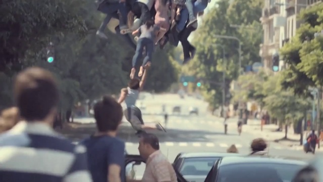 Video Reference: Mode of transport, Tree, Crowd, Pedestrian, Vehicle, Stunt performer, Traffic, Automotive window part, Auto part, Plant, Person