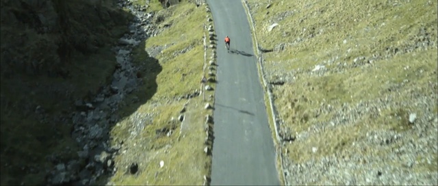 Video Reference: geological phenomenon, adventure, fault, terrain, escarpment, geology, aerial photography, bungee jumping, sport climbing, outcrop, Person