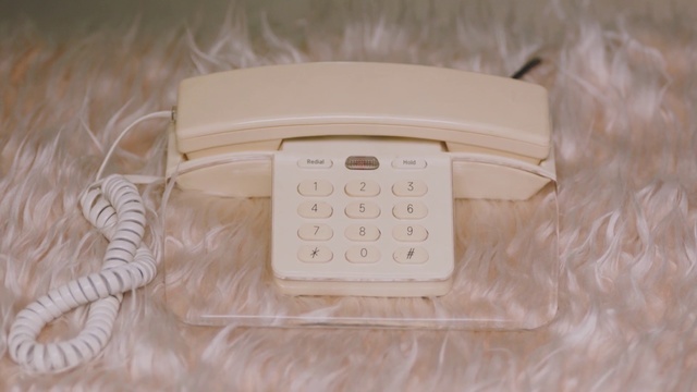 Video Reference: Corded phone, Technology, Telephone, Electronic device, Telephony, White, Indoor, Sitting, Table, Remote, Game, Computer, Video, Player, Playing, Laying