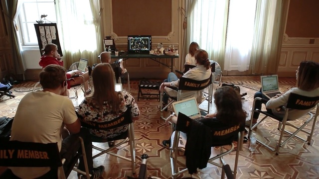 Video Reference: room, furniture, table, communication, recreation, audio, electronic device, conversation