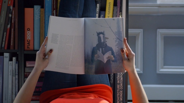 Video Reference: book, design, furniture, Person