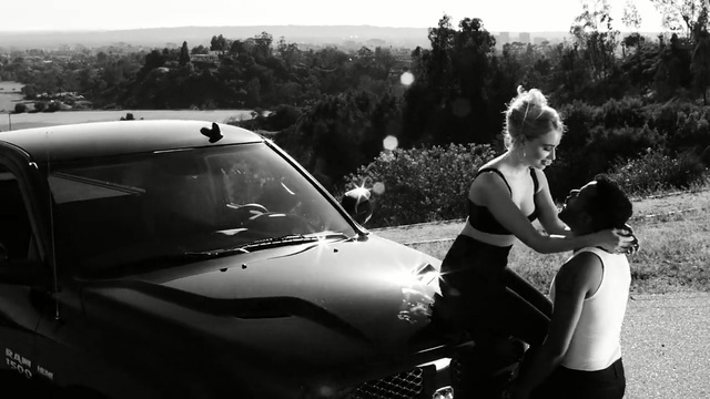 Video Reference: land vehicle, car, motor vehicle, vehicle, black, black and white, automotive design, photography, snapshot, automotive exterior, Person