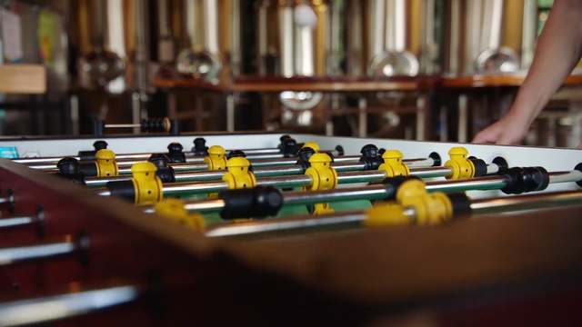 Video Reference: Yellow, Indoor, Table, Person, Laptop, Computer, Desk, Toy, Sitting, Food, Small, Front, Room, Keyboard, Orange, Wooden, Cake, Kitchen, Man, White, Board