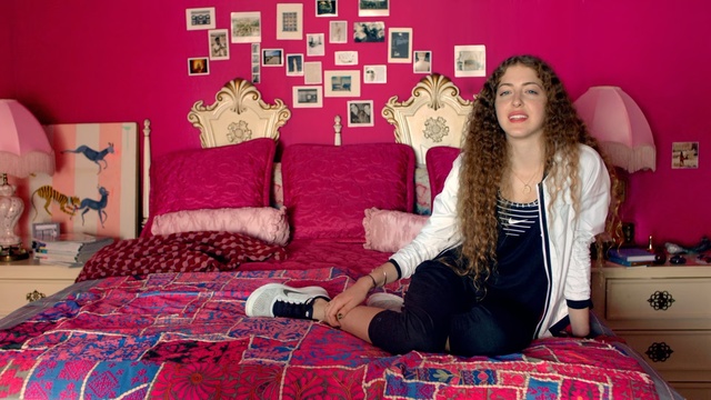 Video Reference: Pink, Bedroom, Room, Red, Magenta, Bed sheet, Wall, Textile, Furniture, Linens, Person