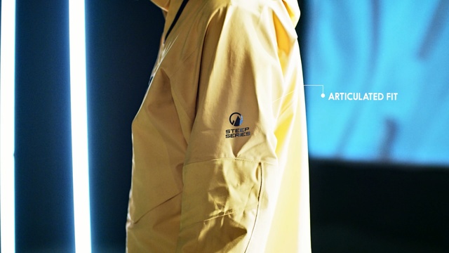 Video Reference: yellow, shoulder, outerwear, t shirt, sleeve, fashion, product, joint, top, brand, Person