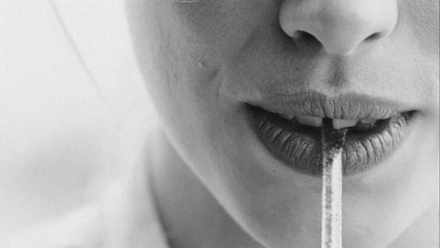 Video Reference: lip, face, eyebrow, black and white, nose, chin, monochrome photography, close up, eyelash, facial hair