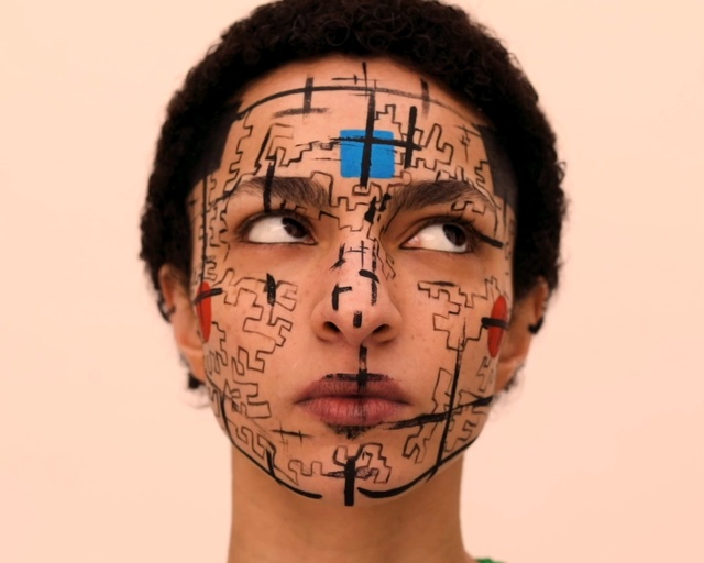 Video Reference: Face, Forehead, Skin, Head, Cheek, Nose, Chin, Eyebrow, Human, Tattoo, Person