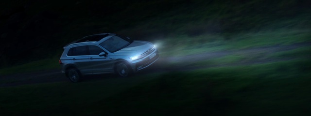 Video Reference: car, motor vehicle, darkness, mode of transport, sky, light, automotive design, night, photography, automotive lighting