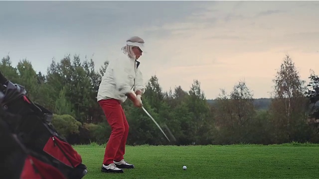 Video Reference: Golfer, Golf, Golf equipment, Golf course, Iron, Golf club, Sport venue, Pitch and putt, Professional golfer, Wedge