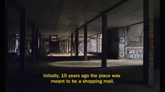 Video Reference: Darkness, Wall, Architecture, Urban area, Building, Font, Glass, Room, Art, Visual arts