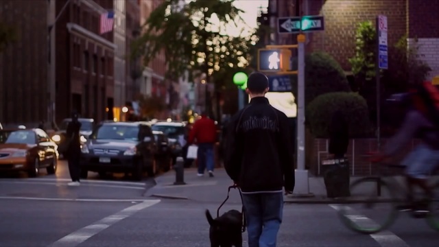 Video Reference: Street, Urban area, Lane, Pedestrian, Lighting, Snapshot, Mode of transport, Town, Downtown, Road, Person