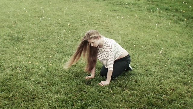 Video Reference: People in nature, Grass, Lawn, Meadow, Grassland, Fun, Plant, Pasture, Person, Outdoor, Frisbee, Field, Dog, Green, Small, Playing, Grassy, Brown, Ball, Little, White, Mouth, Standing, Young, Yard, Throwing, Game, Park, Catch, Large, Air, Umbrella, Man, Holding, Jumping, Flying, Clothing, Girl, Lush