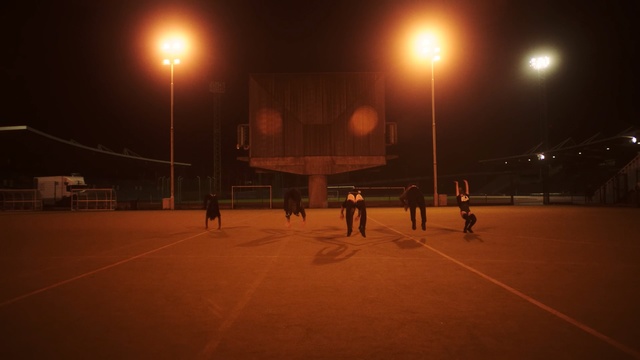 Video Reference: night, atmosphere, darkness, sky, light, street light, lighting, structure, sport venue, evening, Person