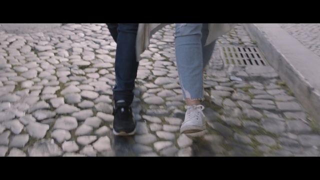 Video Reference: footwear, shoe, leg, cobblestone, road surface, human leg, foot, flooring, grass, floor