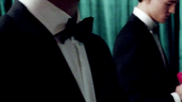 Video Reference: suit, black, man, formal wear, necktie, shoulder, gentleman, male, tuxedo, outerwear