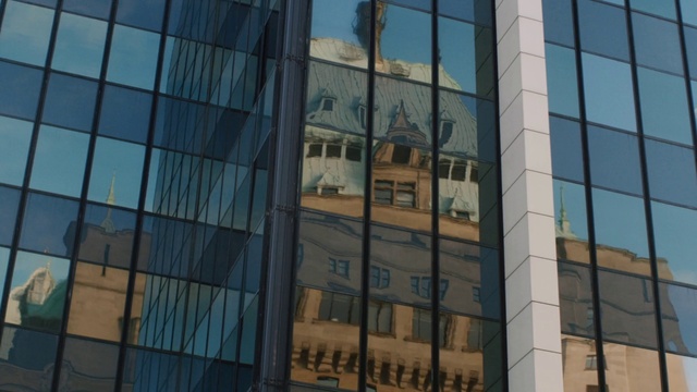 Video Reference: Reflection, Commercial building, Metropolitan area, Daytime, Architecture, Building, Facade, Urban area, Landmark, Sky