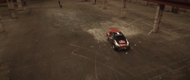 Video Reference: car, mode of transport, floor, asphalt, flooring, vehicle, screenshot, road surface, concrete