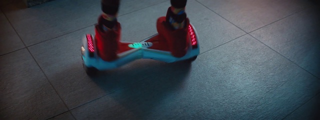 Video Reference: Blue, Red, Fun, Play, Footwear, Kick scooter, Shoe, Sitting, Photography, Vehicle