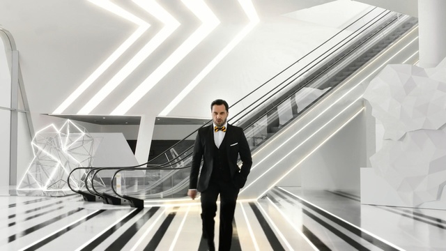Video Reference: Escalator, Standing, Suit, Automotive design, Businessperson, Architecture, Line, Design, White-collar worker, Gentleman